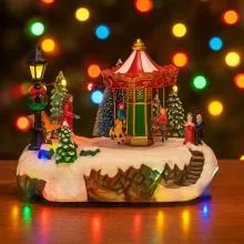 Vrtiljak božični, z LED lučko, ter glasbo, polimasa, na baterije/USB, 20.3x16.5x16cm