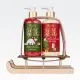 Darilni set HELLO WINTER, božični, (290ml tekoče milo roke, 290ml loisjon za roke),  z vonjem Frosted Cranberry, v darilni embalaži na lesenih saneh
